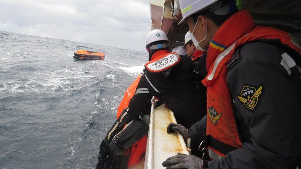 Members of the Korean Coast Guard search for the Jin Tian