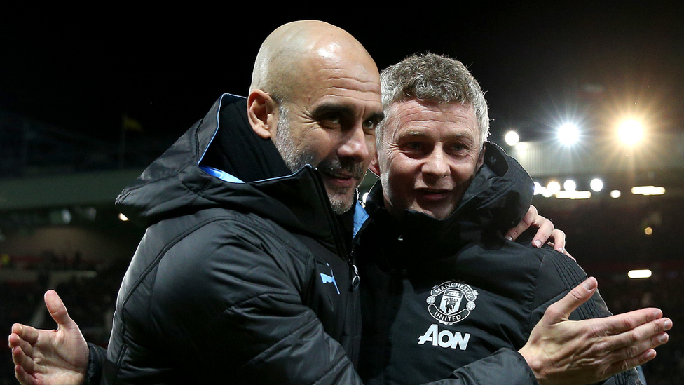 Pep Guardiola, Manager of Manchester City and Ole Gunnar Solskjaer, Manager of Manchester United embrace