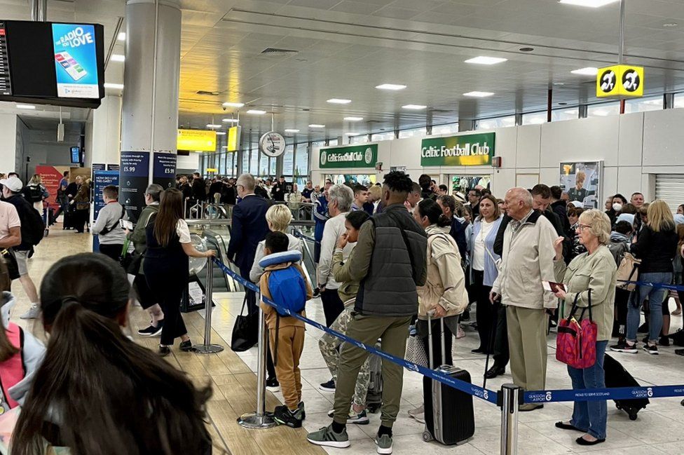 Airport passengers urged not to arrive early despite queues BBC News