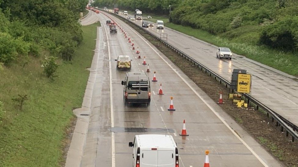 Traffic on A11 northbound, with traffic cones barricading the right-hand lane