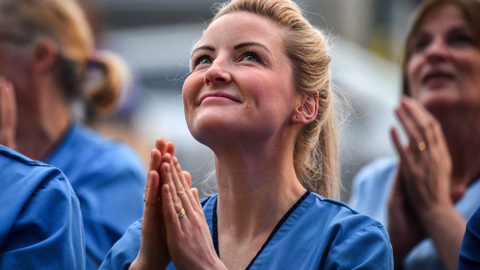 NHS staff at the Queen Elizabeth Hospital participate in the Clap for Carers and key workers during week six of lockdown on April 30, 2020 in