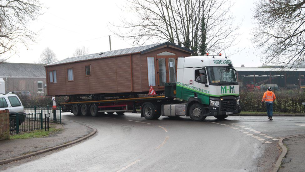 A static caravan being delivered