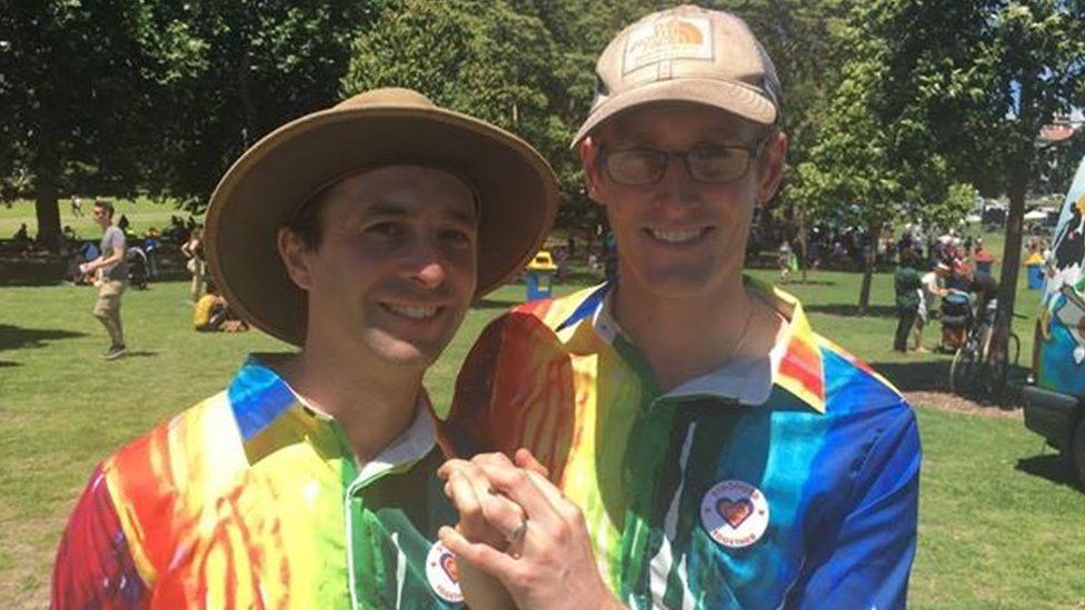 A gay Sydney couple at the reveal of the marriage survey results