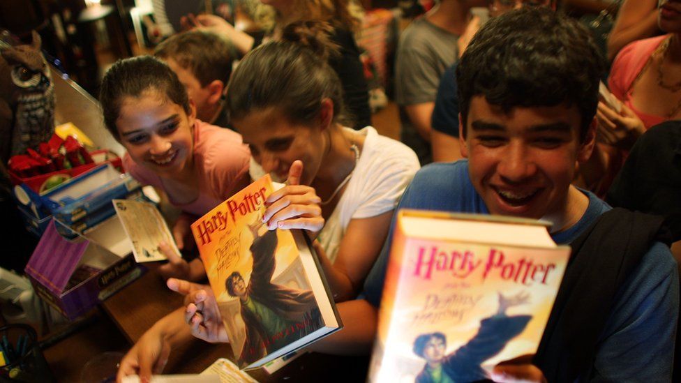 Young adults buying Harry Potter books