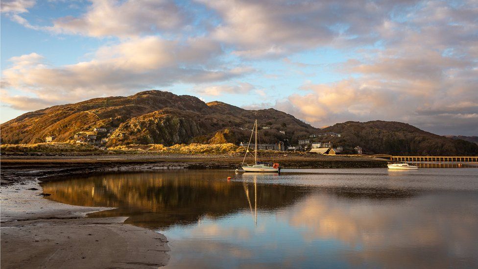 Boats lay still at sundown on the magnificent Mawddach Estuary, a serene scene captured by Barbara Fuller