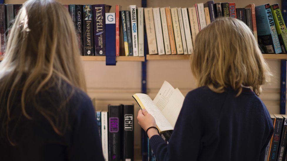 School girls reading books