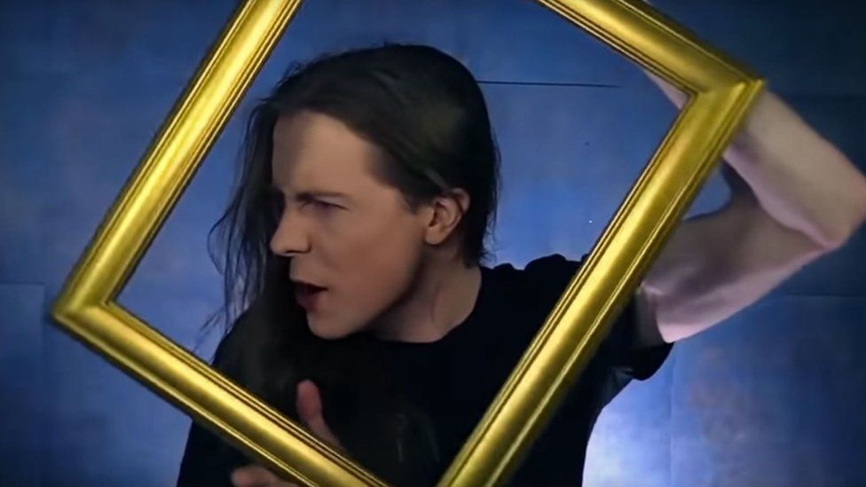 Jared Threatin, of the rock band Threatin, in a still taken from the music video for Living is Dying