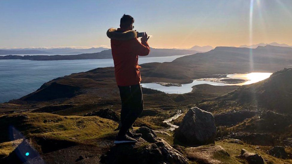 A man on top of the Storr in Skye