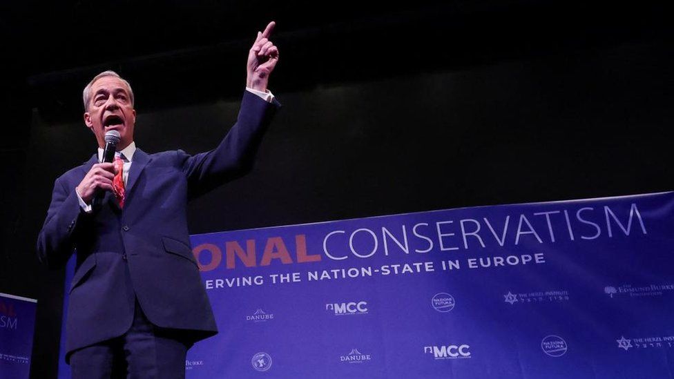 Nigel Farage on stage at the National Conservatism event in Brussels
