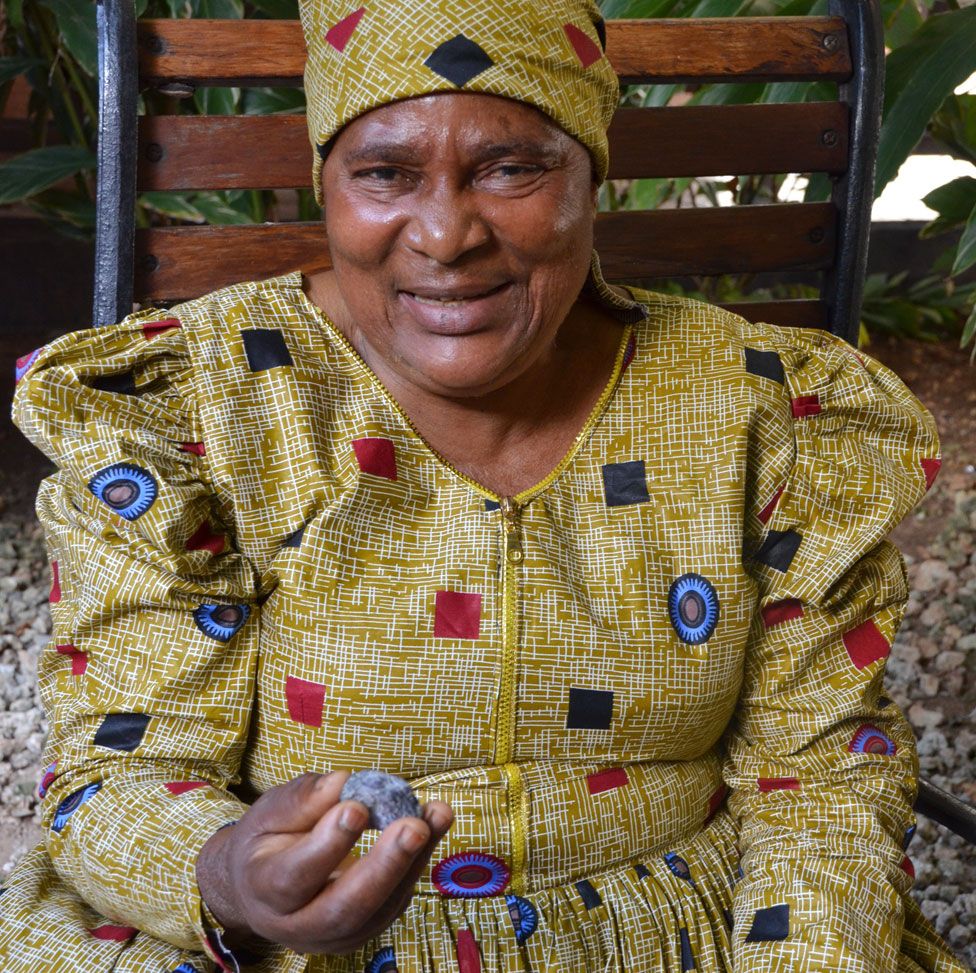 Pili Hussein pictured with a piece of tanzanite
