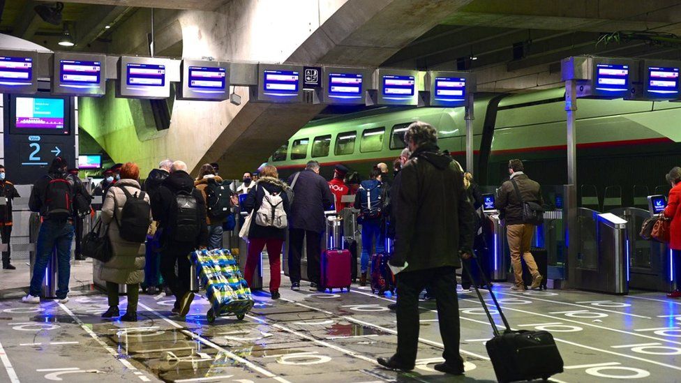 Passengers wait before boarding trains at Montparnasse railway station in Paris, on March 19, 2021