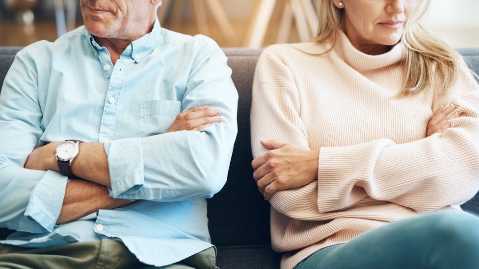 Couple facing away from each other