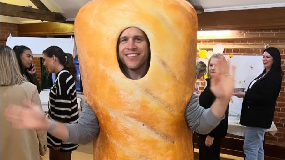 Olly Murs dressed in a sausage roll costume