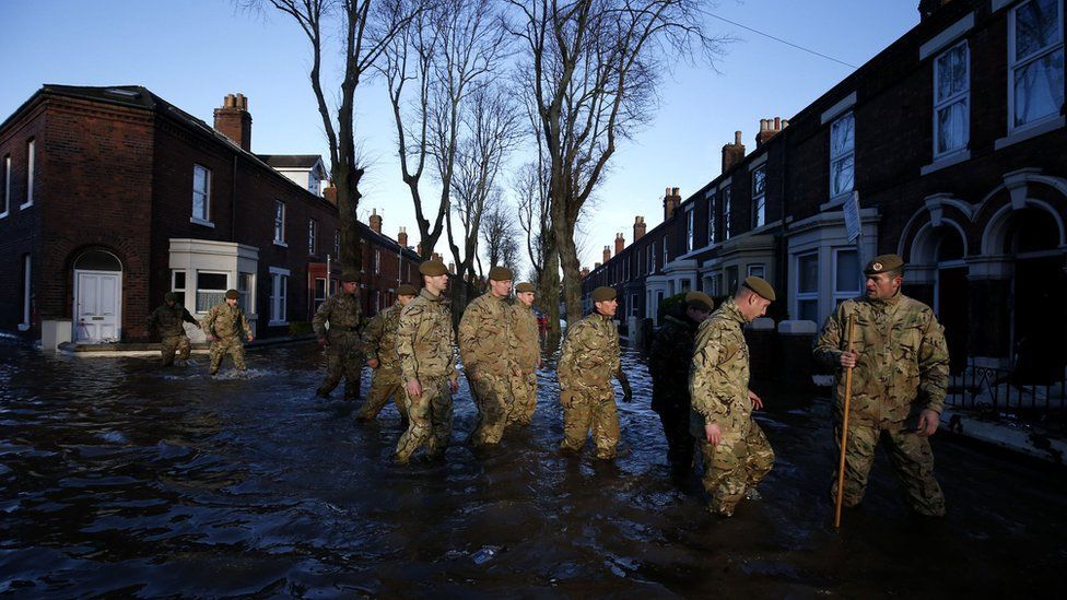 Soldiers wade through flood in Carlisle
