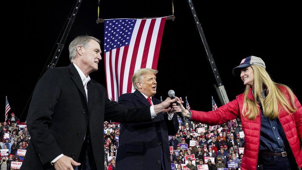 Senators David Perdue and Kelly Loeffler on stage with then-President Donald Trump in Georgia in 2020
