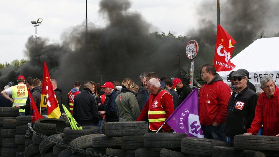 Strikers outside a refinery in Douchy les Mines, northern France, on 24 May 2016
