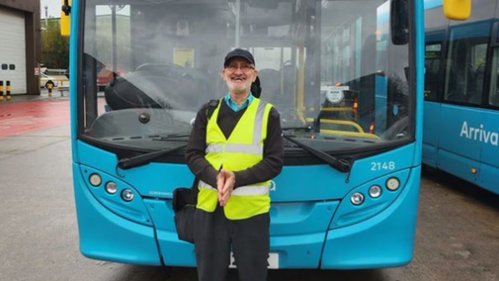 Driver Domingos Correia stood by an Arriva bus