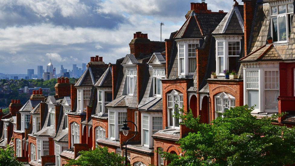 Houses with city of London in background