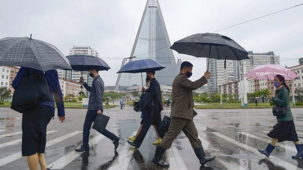 People wear masks on the streets of Pyongyang, North Korea. File photo
