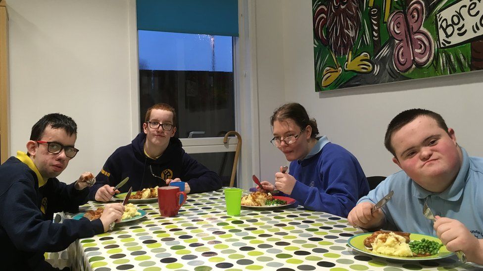 L-R Rhodri, Jac, Portia, Ben eating supper at Hafan y Sêr, Penrhyndeudraeth, Gwynedd