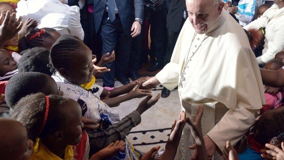 Pope Francis blesses the crowd at the Church of Saint Joseph the Worker in the Nairobi shanty town of Kangemi in Kenya - 27 November 2015