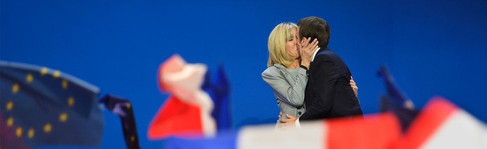 Emmanuel Macron embraces Brigitte Trogneux after his first-round victory