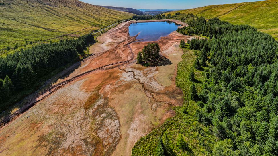 Cantref Reservoir in in Nant-Ddu, Cwm Taf, Brecon Beacons Powys, Wales, which is owned by Welsh Water, photographed from a drone which shows how low the water level has dropped.