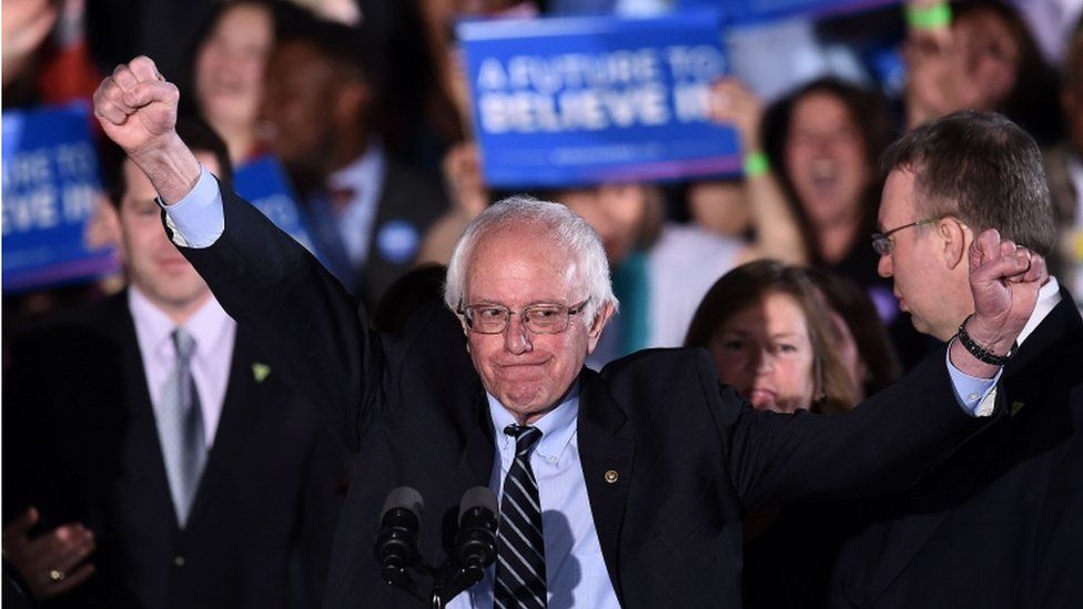 US Democratic presidential candidate Bernie Sanders reacts on stage during a primary night rally in Concord, New Hampshire, on February 9, 2016