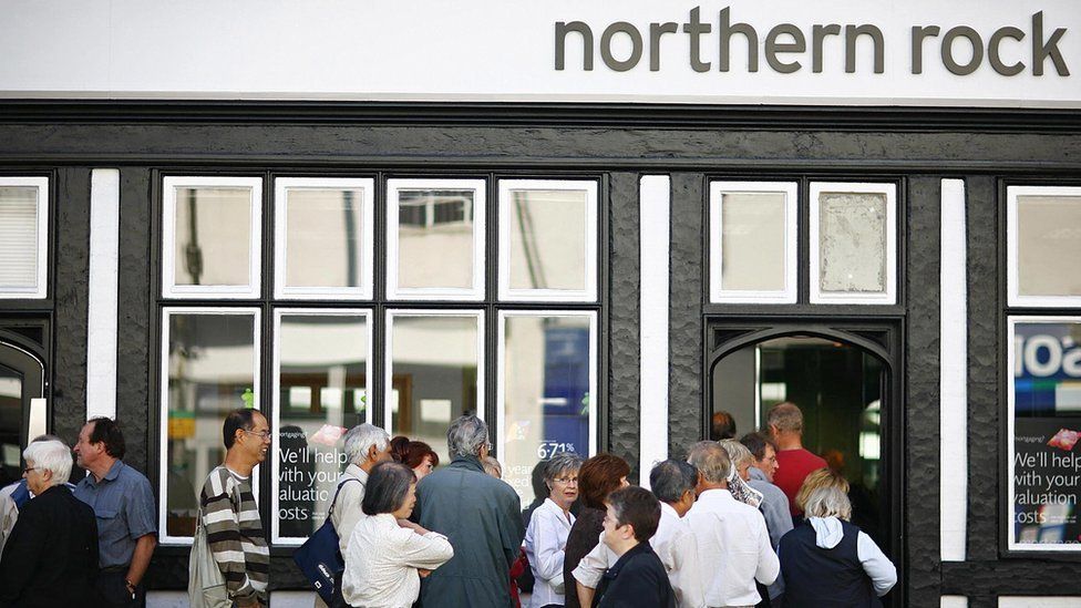 Customers queue outside a Northern Rock branch in 2007
