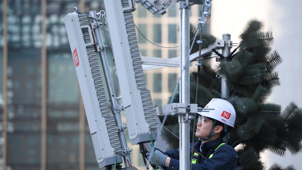 Technician checks 5G antenna in Seoul in April 2019