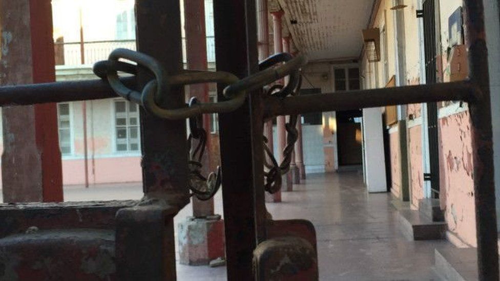 A padlock on a gate at the Sagrados Corazones school