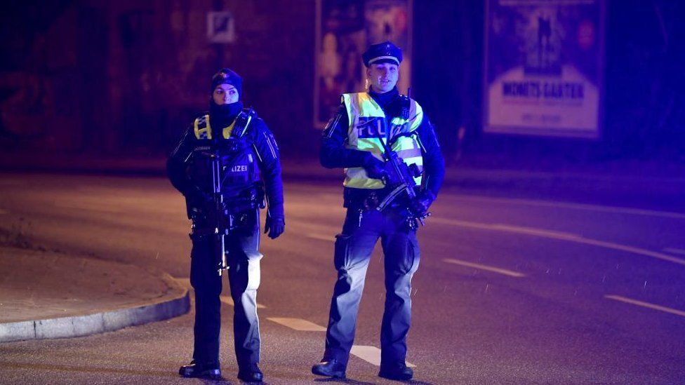 Police secure the area after at least six people are dead and several more injured in a shooting in the northern German city of Hamburg, Germany, March 9, 2023