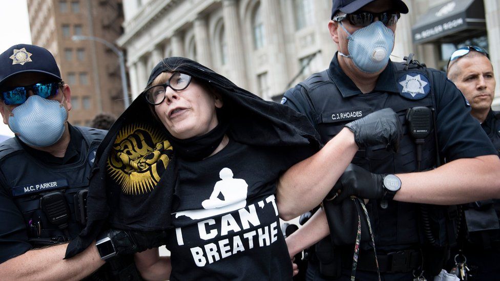A protester is removed by police from an area near where Donald Trump will hold a rally in Tulsa, Oklahoma (20 June 2020)
