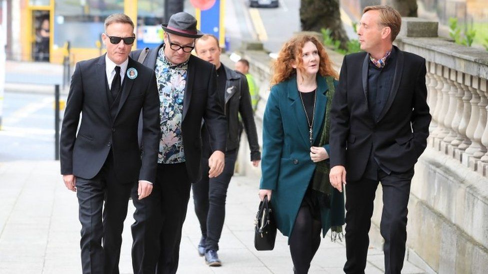 Antony Cotton (left) and Jennie McAlpine (second right) arrive at the funeral service of Martyn Hett,