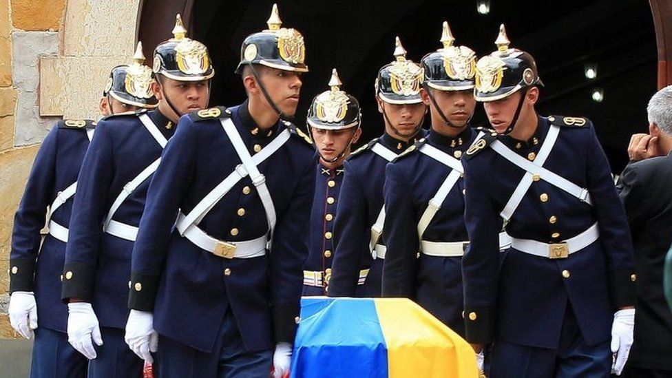 Members of Colombian Presidential Guard carry a coffin with the remains of one of the eleven Colombian soldiers who were killed in an attack by members National Liberation Army (ELN) rebel group on 29 October 2015.