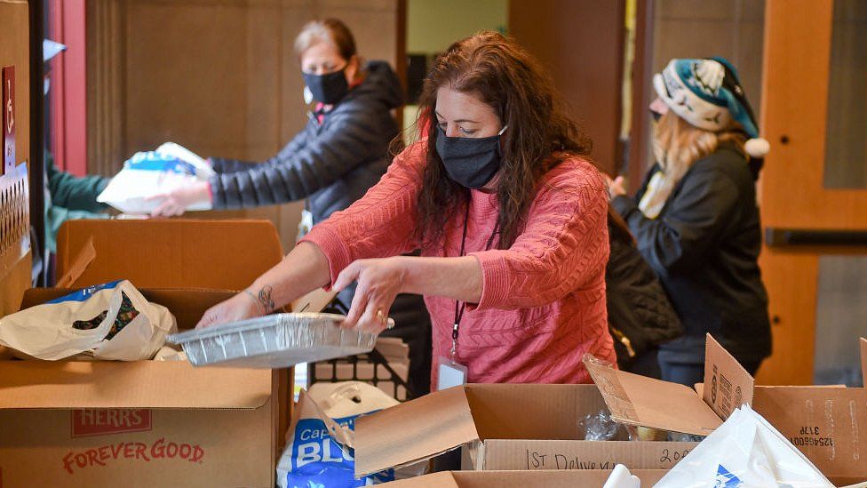 A Social Worker with the Reading School District, Pennsylvania, helps to pack up meals to be distributed on December 22, 2020