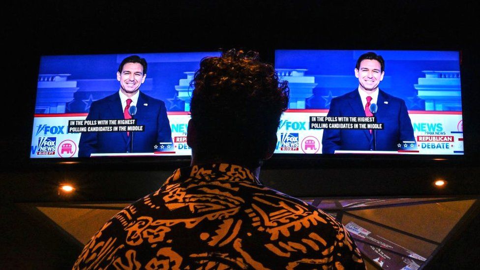 A member of the Atlanta Young Republicans attends a watch party of the first Republican Presidential primary debate at a bar in Atlanta, Georgia on August 23