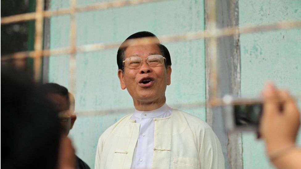 Former Myanamar prime minister and military intelligence chief Khin Nyunt, being photographed as he arrives to cast his vote at a polling station in Yangon on 1 April 2012.