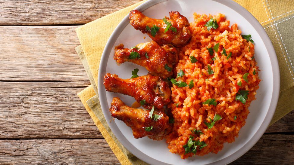 Nigerian jollof rice with fried chicken wings