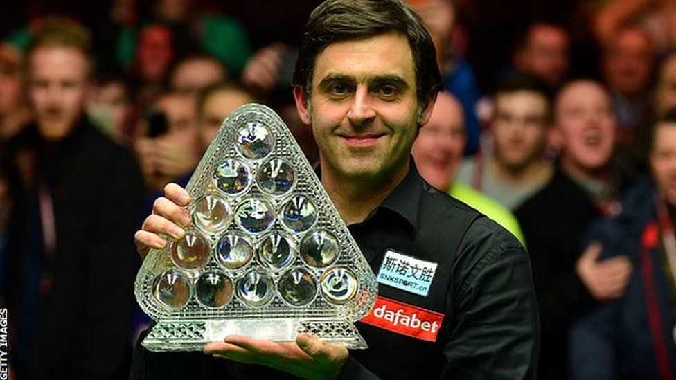 Ronnie O'Sullivan celebrates with the Masters trophy