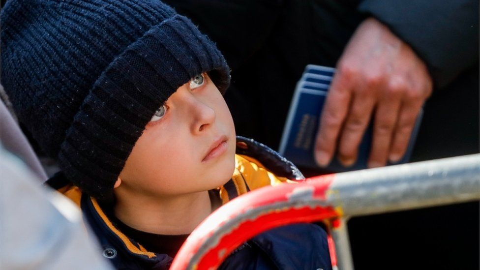A child who fled Ukraine after the Russian war waits outside an immigration centre office in Brussels, Belgium, 18 March 2022.