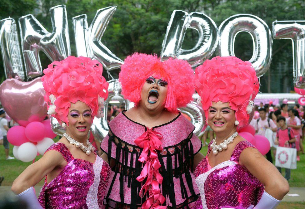 Participants dressed in pink pose for a photograph at the annual 'Pink Dot' event in a public show of support for the LGBT community at Hong Lim Park in Singapore on 13 June 2015.