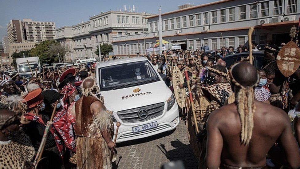 Mourners make way for the hearse in front of the morgue in Johannesburg