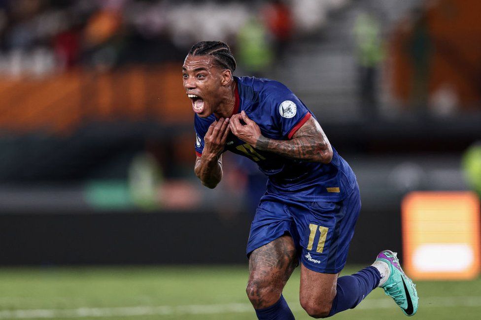 Cape Verde's forward Garry Rodrigues takes off his jersey as he celebrates scoring his team's second goal.