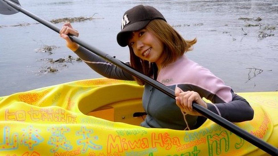 This handout picture taken by Rokudenashiko and Marie Akatani on 19 October 2013 shows artist Megumi Igarashi paddling a kayak designed to be the shape of her own vagina in Tokyo.