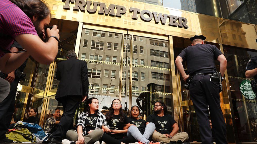 immigration activists chain themselves to the front of Trump Tower