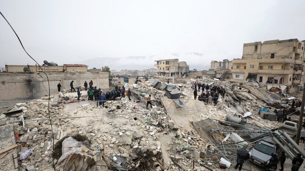 Rescuers work at the site of a collapsed building following an earthquake in Armanaz town, Idlib Governorate, Syria 06 February 2023.