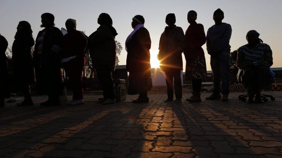 People stand in a queue to cast their vote during the municipal elections in Alexandra township, Johannesburg, South Africa, 03 August 2016.