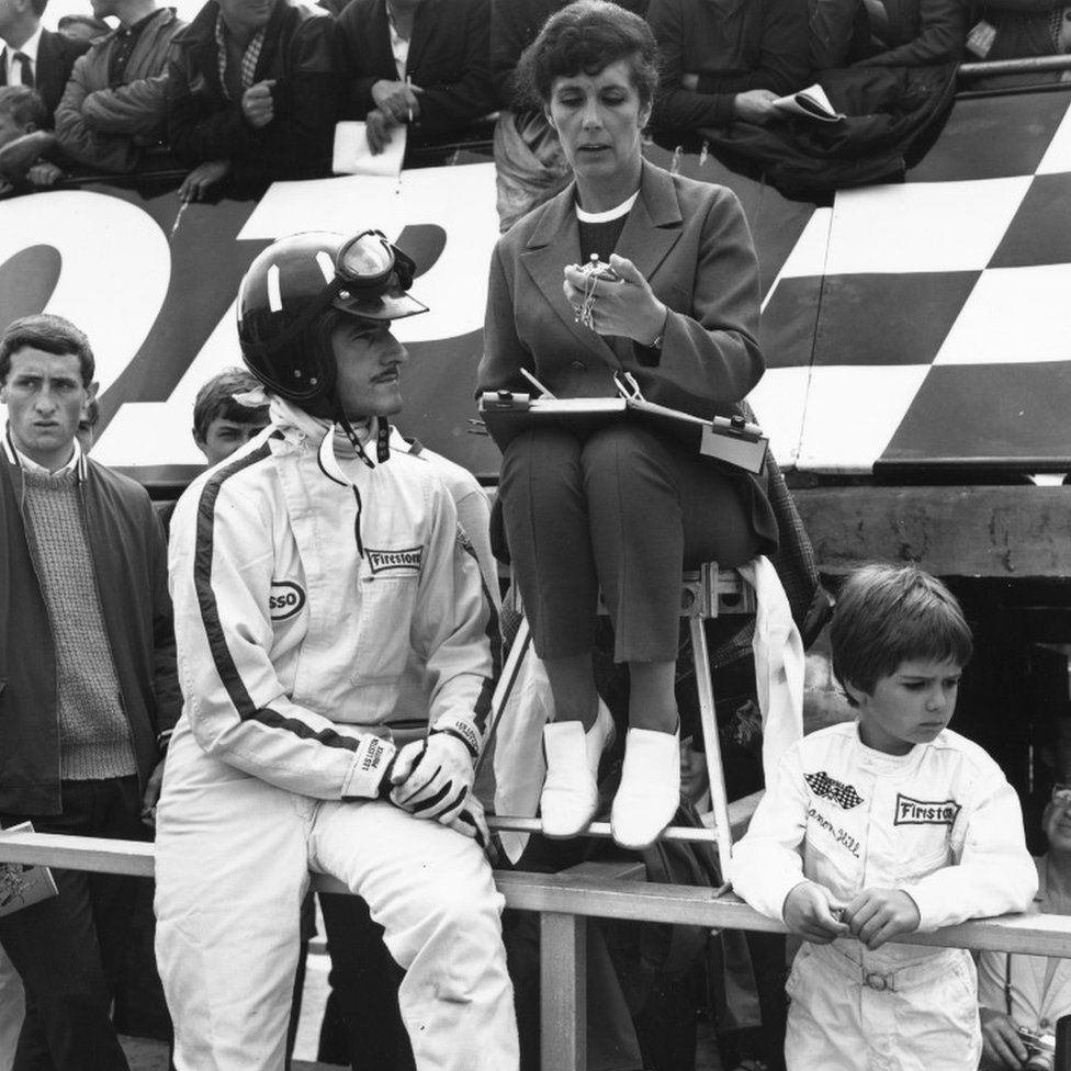 July 1967: British racing driver Graham Hill with his wife and his six-year-old son Damon, who went on to become a world champion driver himself, at Silverstone.