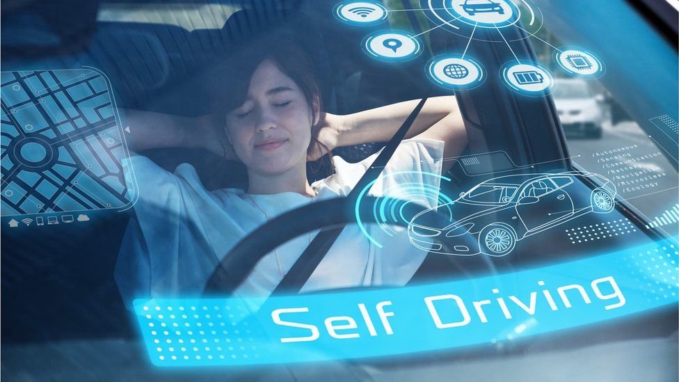 Woman asleep at wheel of futuristic self-driving car